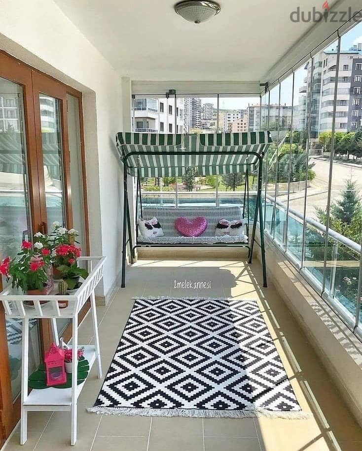 Apartment for sale in installments with a distinctive roof on the landscape in the Taj City compound in front of the airport 4