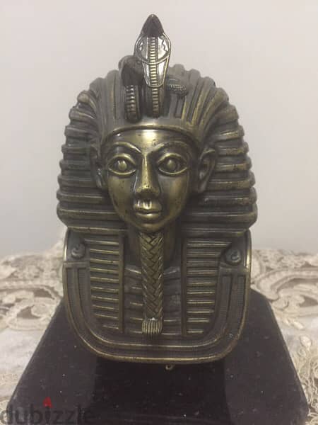 a copper mask of tutankhamun 6