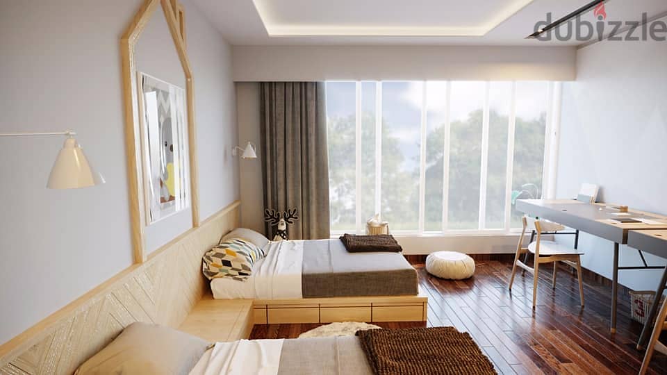 Two-bedroom apartment at old prices with only a down payment of 400,000 and installments over 7 years. 7