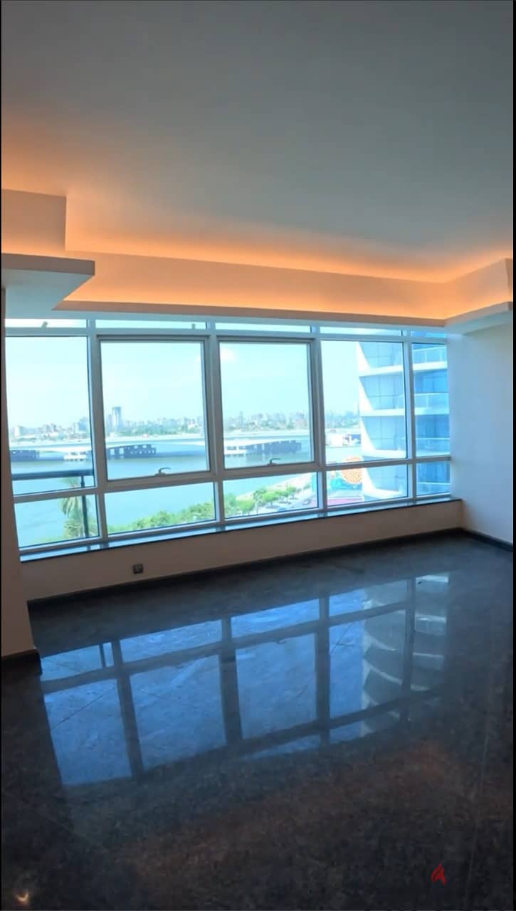 Smart apartment 415 sqm for sale, immediate receipt, Hilton services, in front of the Nile, in front of Gold Island, in Nile Towers 6
