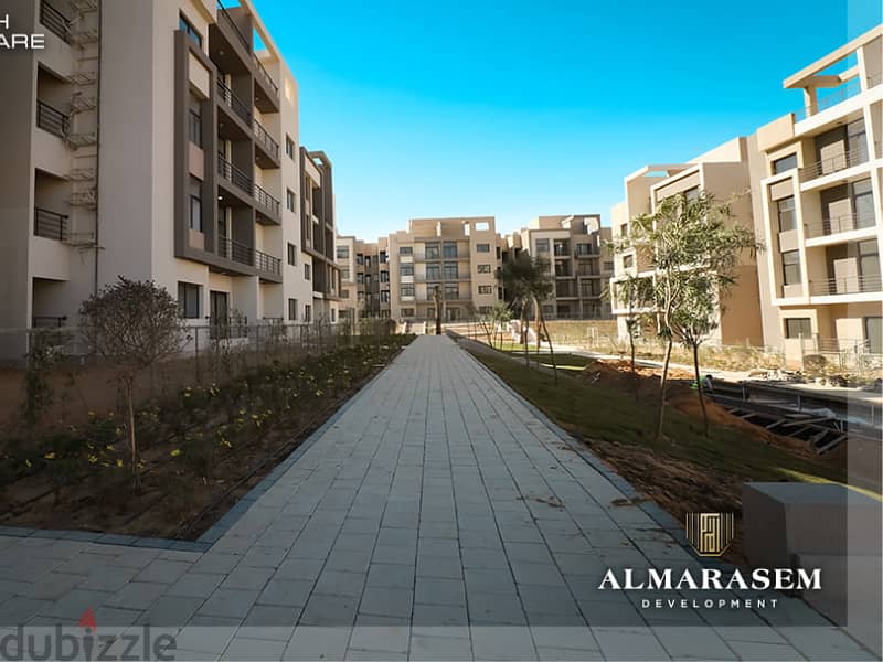Own your immediate 3-bedrooms apartment in New Cairo in Fifth Square Compound In installments over the longest payment plan View on the landscape 1