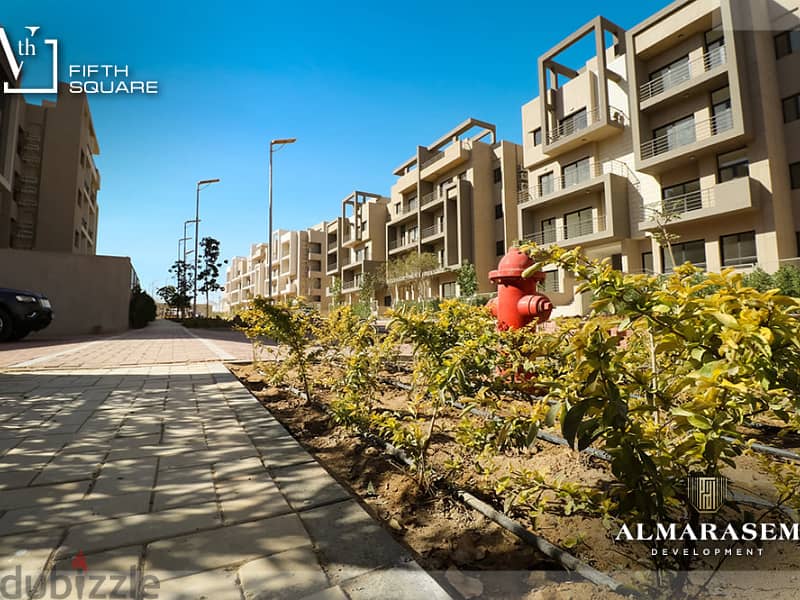 Own your immediate 3-bedrooms apartment in New Cairo in Fifth Square Compound In installments over the longest payment plan View on the landscape 2