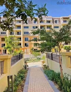 For sale, 206 sqm apartment + 117 sqm garden, in the heart of the Fifth Settlement, next to Madinaty, in Sarai Compound, in installments. 0