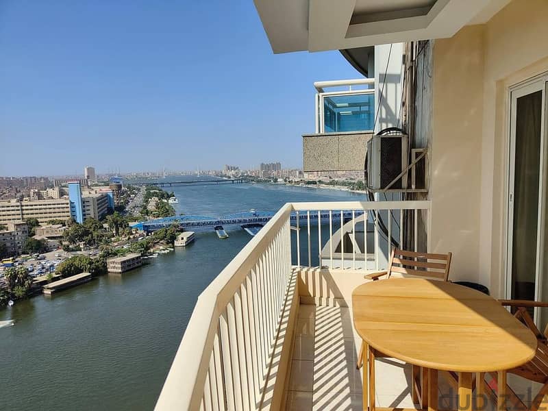 For sale, an apartment in Hilton Towers, fully finished, with air conditioners, immediate receipt, first row on the Nile 2