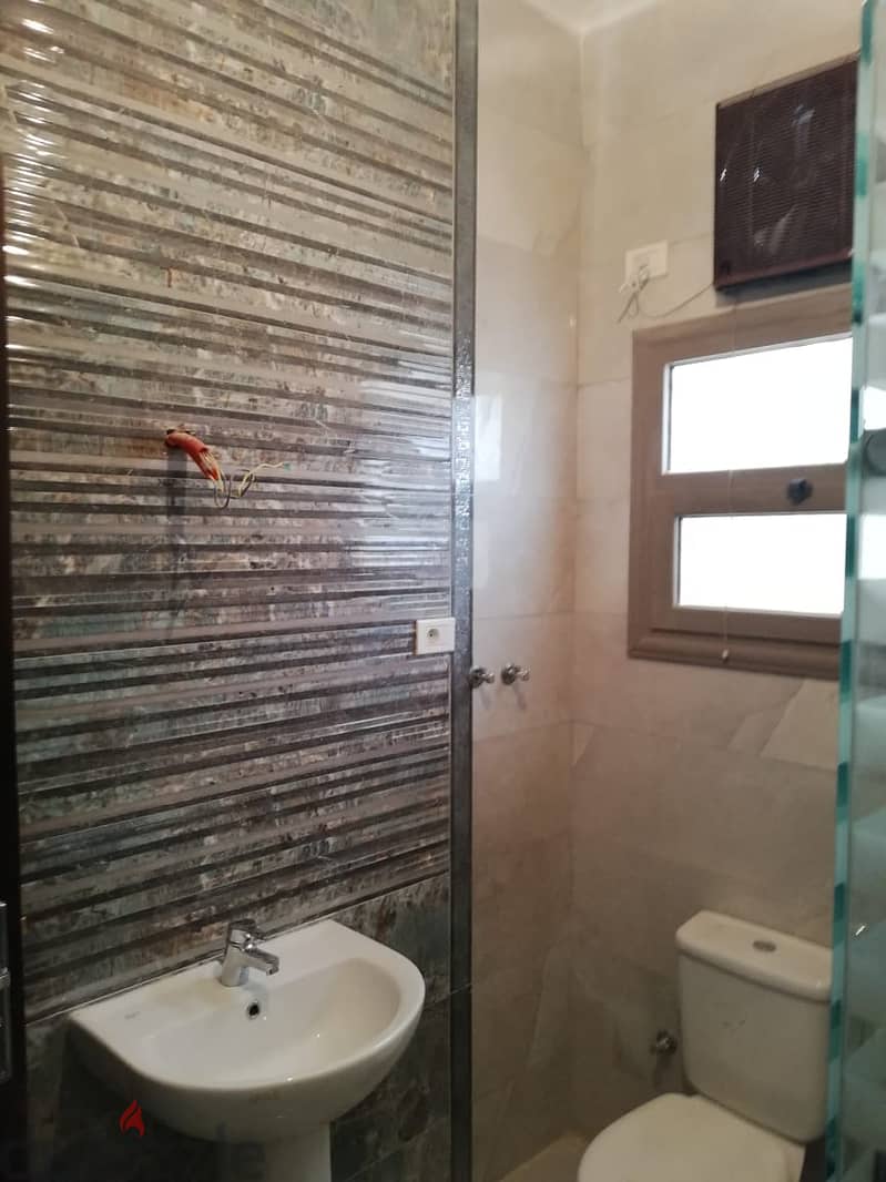 Apartment for sale in Al-Mousshoureen Compound, near Mohamed Naguib Axis, the American University, and Future University  Finishing: Super Lux 7