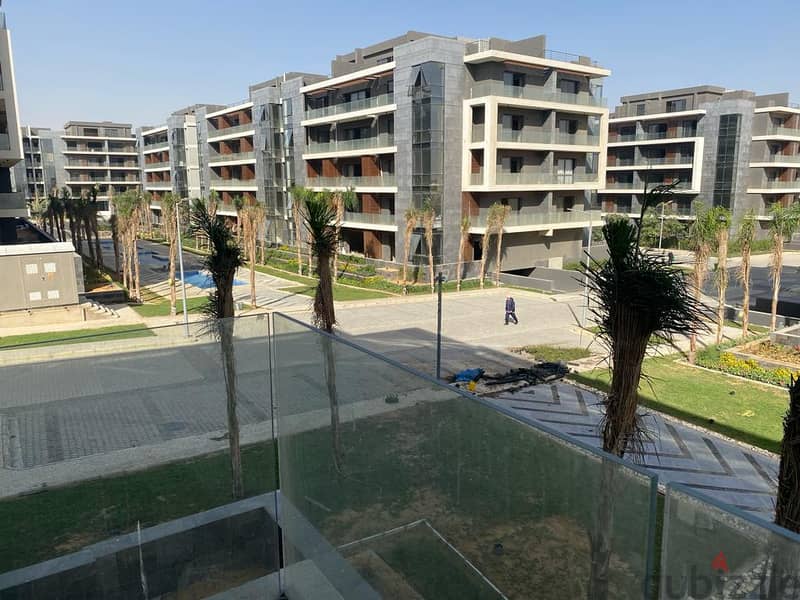 Apartment for sale in the Administrative Capital, El Patio Oro Compound, near Al-Fattah Al-Aleem Mosque  Eastern sea  View landscape and waterfalls 1