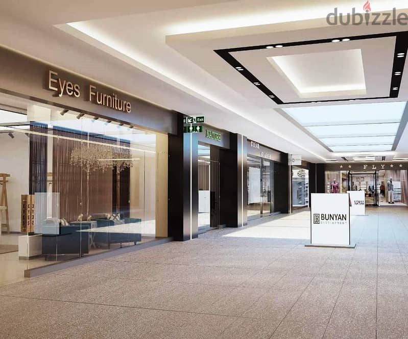 192 sqm shop for sale, super luxurious finishing with air conditioning, in Valory Commercial Mall, directly on Al Thawra Street, near Almaza City Cent 1