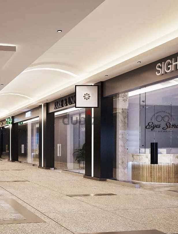 192 sqm shop for sale, super luxurious finishing with air conditioning, in Valory Commercial Mall, directly on Al Thawra Street, near Almaza City Cent 7