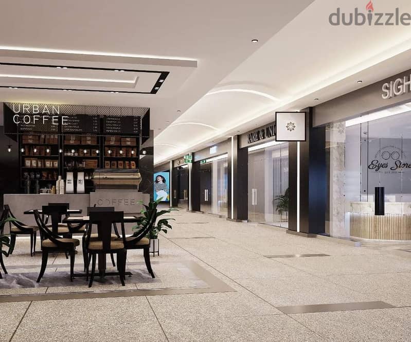 192 sqm shop for sale, super luxurious finishing with air conditioning, in Valory Commercial Mall, directly on Al Thawra Street, near Almaza City Cent 9