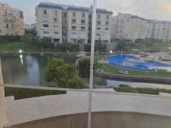 Furnished apartment for rent ( View on the Majestic Lake and the swimming pool ) in a compound  Mountain View Hyde Park 0
