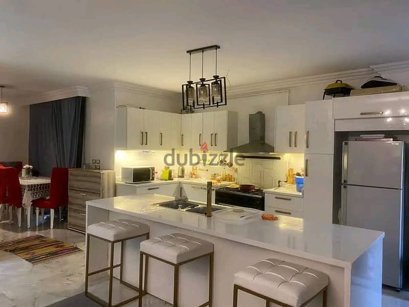 Apartment with garden for sale, immediate receipt, in the heart of Golden Square, Fifth Settlement 2