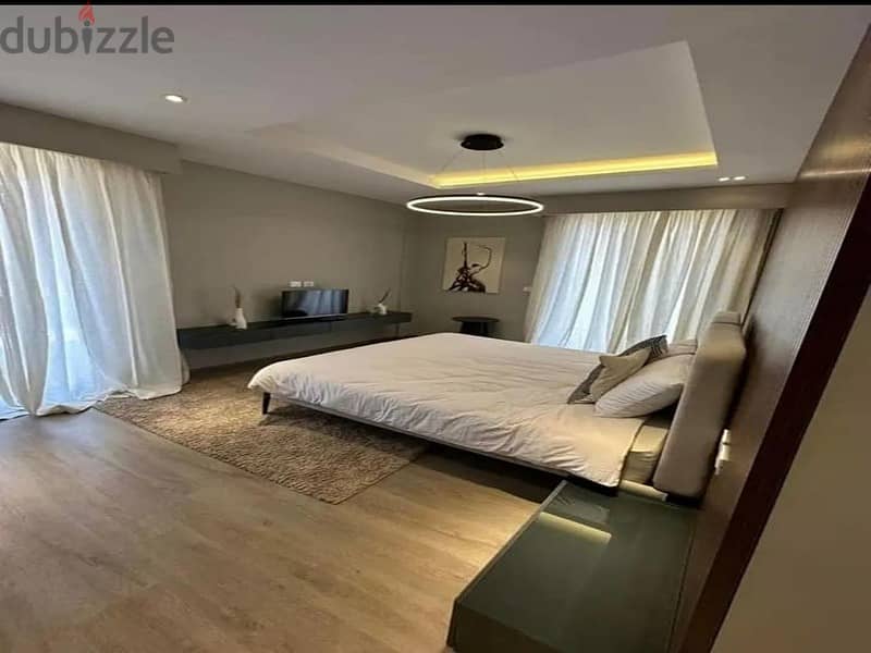 3-bedroom apartment, finished, with air conditioners and kitchen cabinets, for sale in the first towers in the Fifth Settlement, minutes from the AUC 5