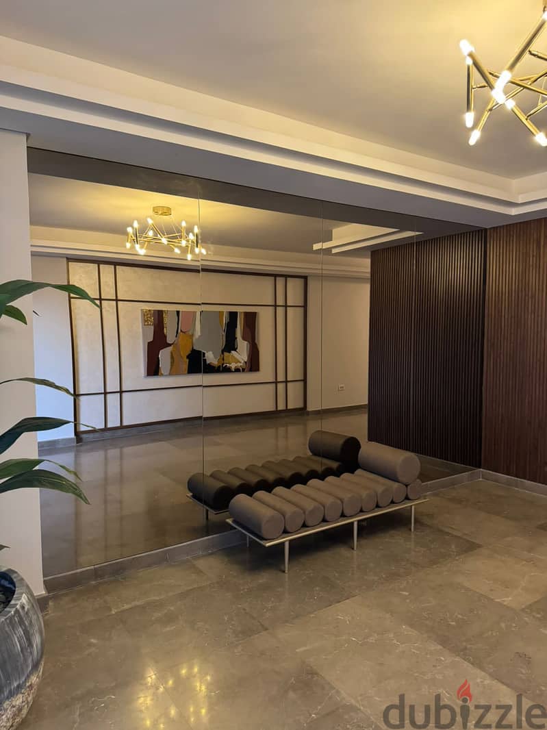 3-bedroom apartment, finished, with air conditioners and kitchen cabinets, for sale in the first towers in the Fifth Settlement, minutes from the AUC 9