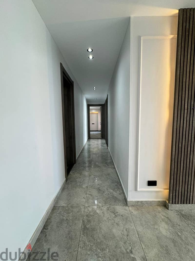 Apartment for sale, 243 square meters, ground floor, with garden, finished, ultra modern, next to AUC, in Amorada Compound, Fifth Settlement 4