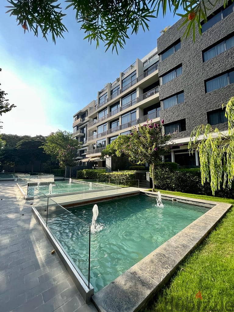With the lowest down payment, invest or live in the most prestigious compound in the Fifth Settlement, Water Way - an apartment with a garden for sale 2