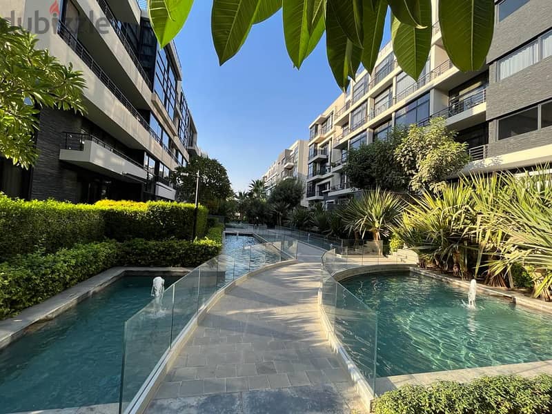 With the lowest down payment, invest or live in the most prestigious compound in the Fifth Settlement, Water Way - an apartment with a garden for sale 5