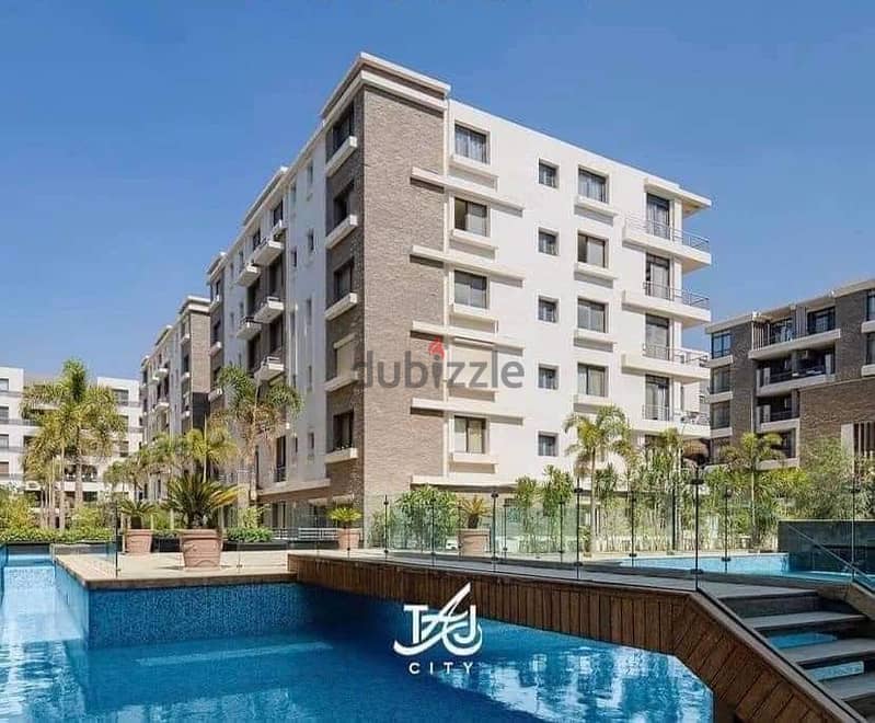 130 sqm ground floor apartment with 45 sqm garden in Taj City Compound in front of Cairo Airport, prime location, cash price 6 million after discount 1