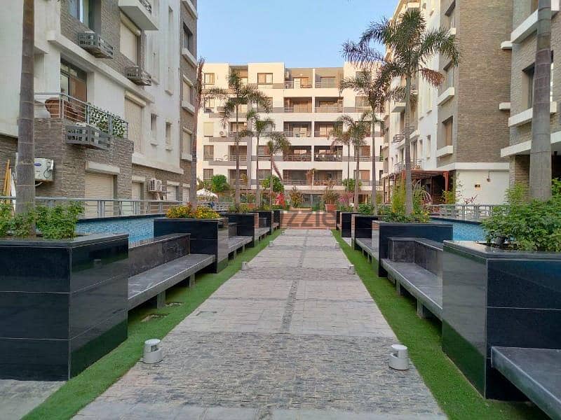 130 sqm ground floor apartment with 45 sqm garden in Taj City Compound in front of Cairo Airport, prime location, cash price 6 million after discount 18