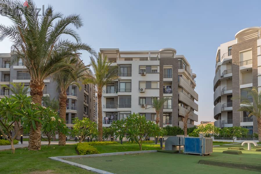 For sale, an apartment with garden, 130 sqm, in Taj City, minutes from Nasr City 3