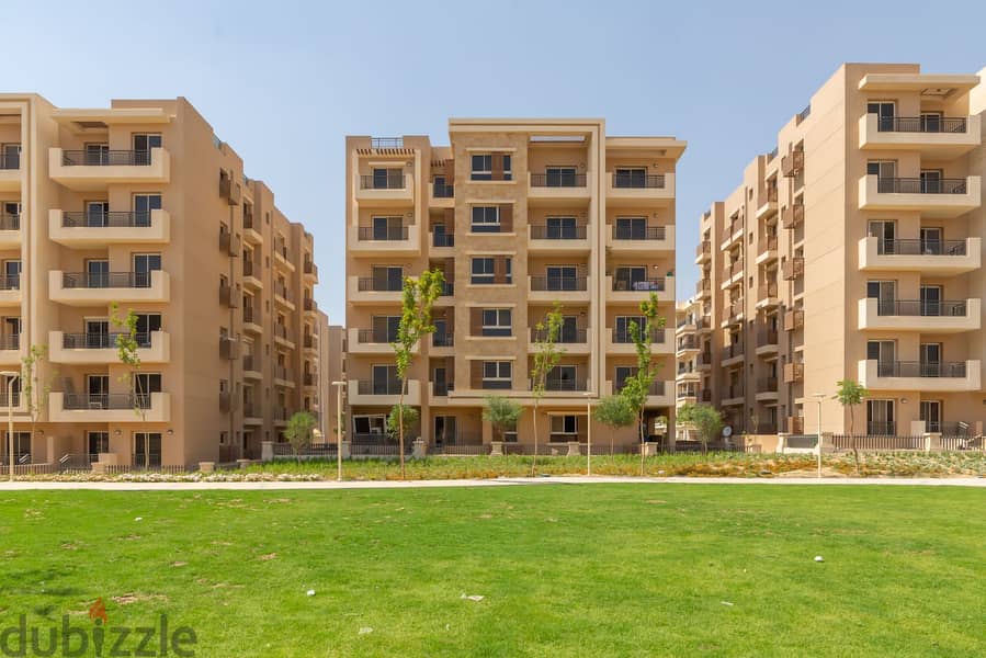 For sale, an apartment with garden, 130 sqm, in Taj City, minutes from Nasr City 4