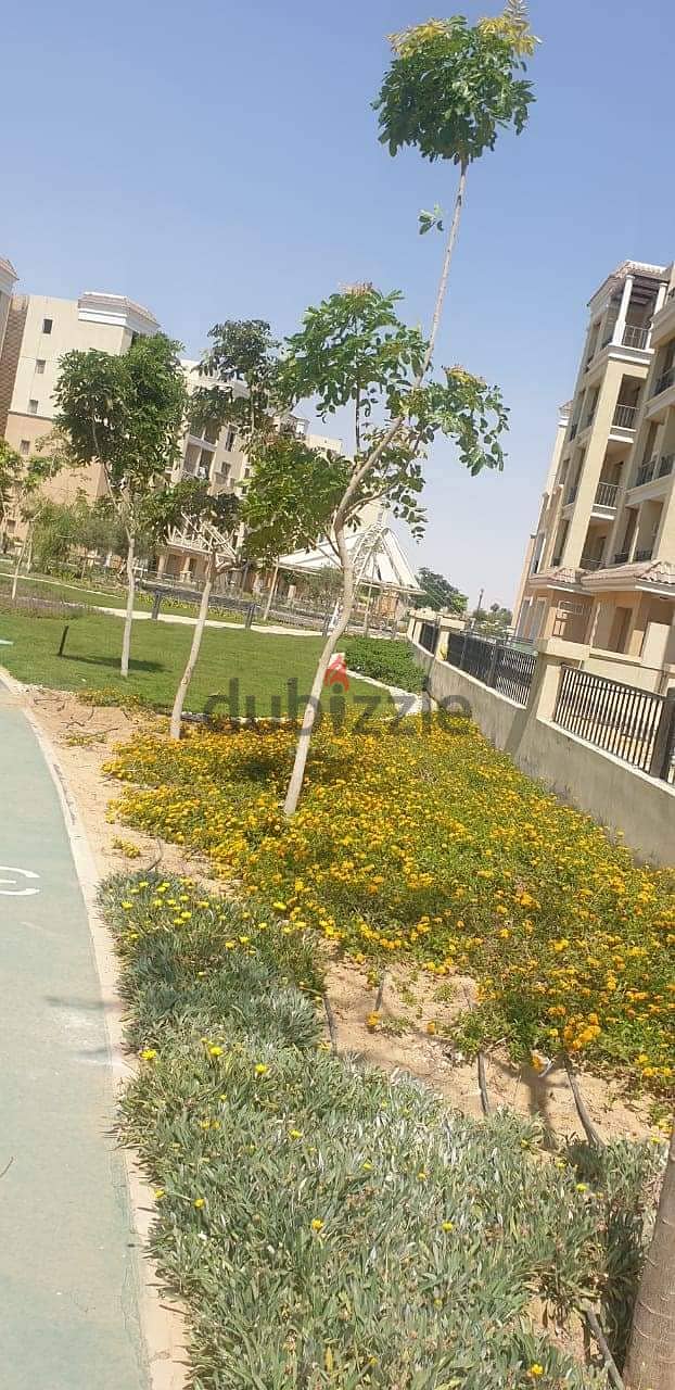 Independent villa 175 sqm + garden 180 sqm and roof 54 sqm for sale in Sarai Compound, New Cairo City Wall 6