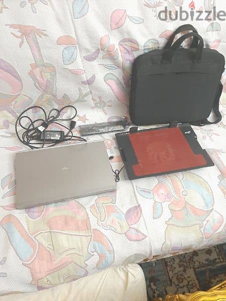 لاب توب(EliteBook) HP i7-UJU2 بالشاحن مع حقيبته و حامل و بطارية اضافيه 8