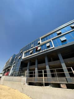 محل تجاري 91 متر أرضي للبيع في مول ديونز الشيخ زايد على شارع رئيسي أمام المدرسه الامريكية 0