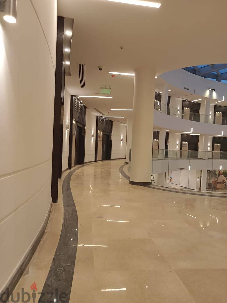 Office for sale in a privileged location in the heart of New Cairo in front of the American University, an area of 148 meters, stores with an annual r 2