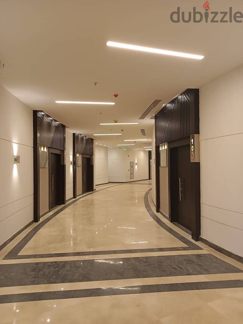Office for sale in a privileged location in the heart of New Cairo in front of the American University, an area of 148 meters, stores with an annual r 5