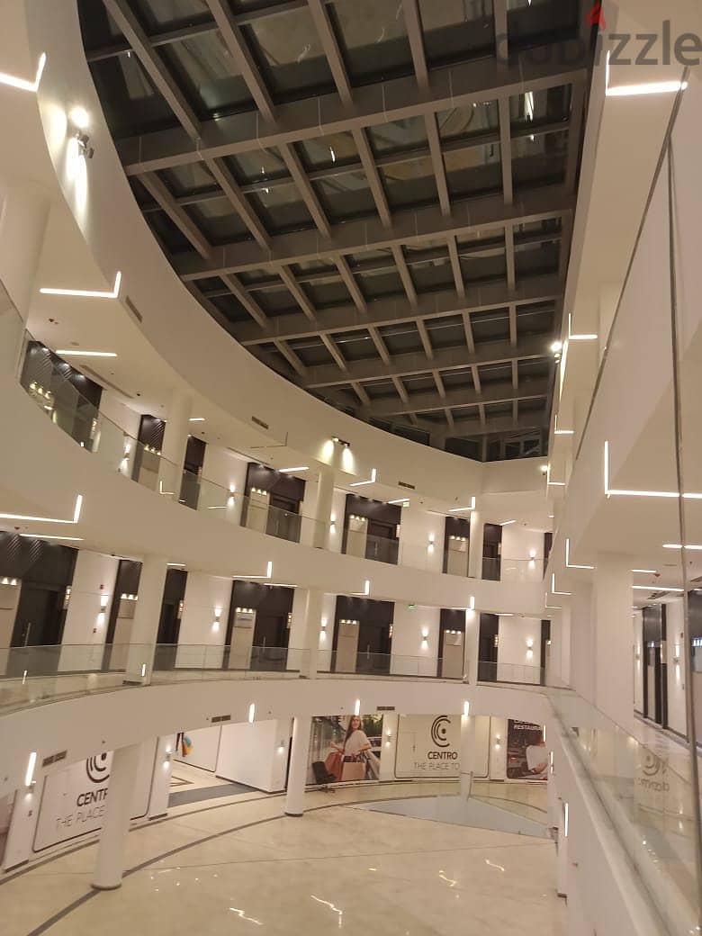 Office for sale in a privileged location in the heart of New Cairo in front of the American University, an area of 148 meters, stores with an annual r 6