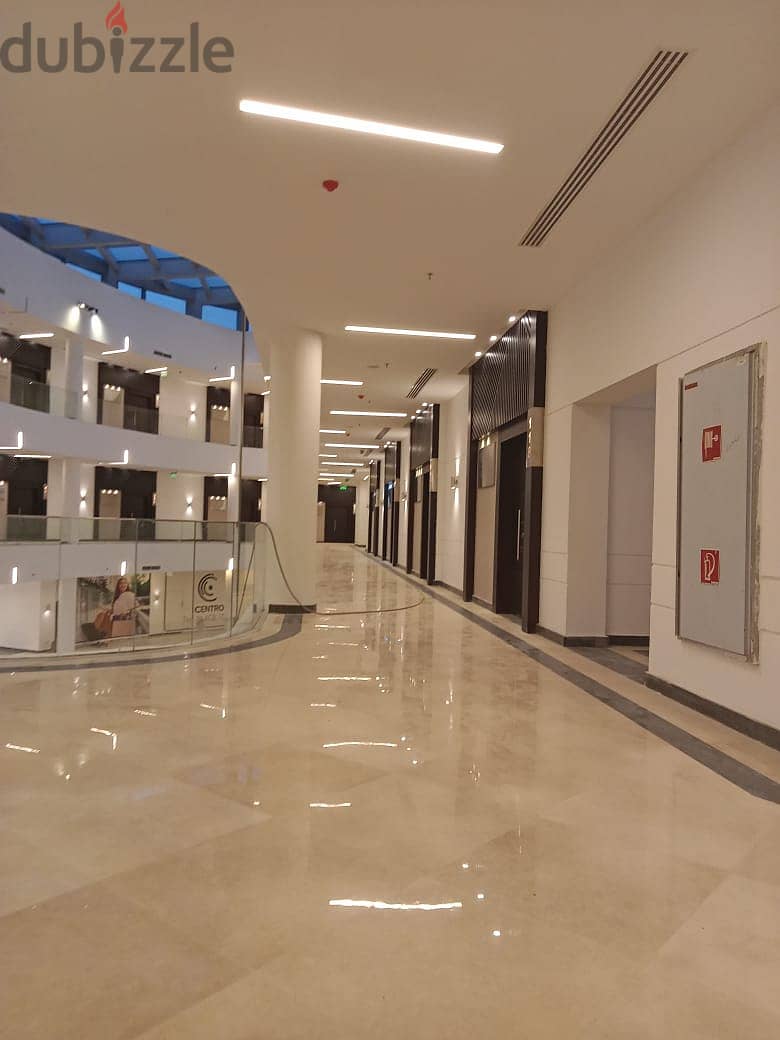 Office for sale in a privileged location in the heart of New Cairo in front of the American University, an area of 148 meters, stores with an annual r 10