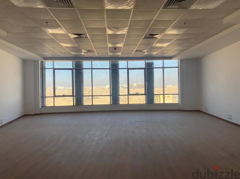 Office for sale in a privileged location in the heart of New Cairo in front of the American University, an area of 148 meters, stores with an annual r 13