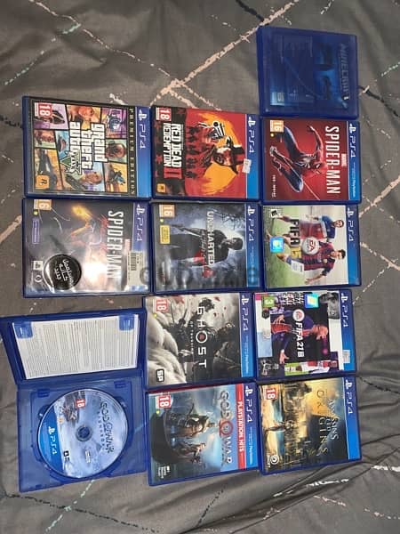 PS4 slim, controller, 2TB Extended storage, and 12 disc games 2