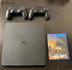 PlayStation 4 with 2 controllers and assassin creed game