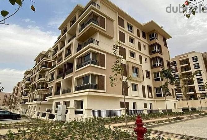 Apartment for sale in front of Cairo Airport, 130 meters + garden 45 meters, with a 39% discount on cash payment in Taj City, New Cairo, Taj City 2