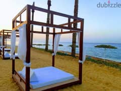 Immediately receive a fully finished chalet with a direct view of the sea in the finest resorts in Ain Sokhna