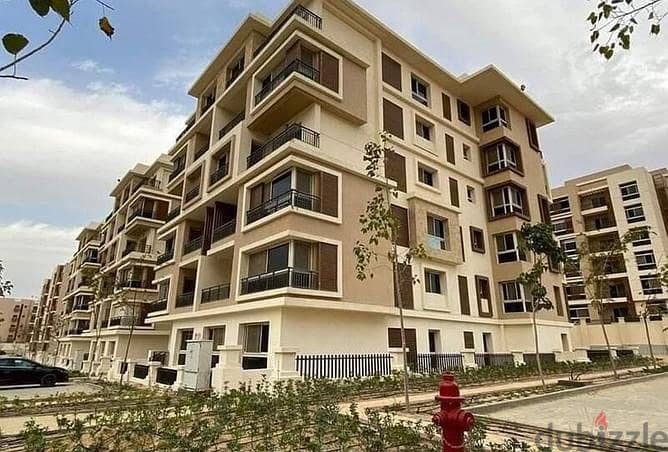 Apartment for sale in front of Cairo Airport, area 225 meters + roof 125 meters, with a 39% discount on cash payment in Taj City, New Cairo 2