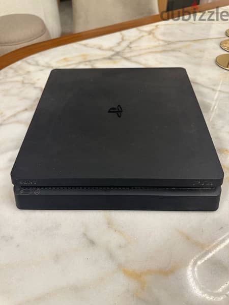 PS4 Slim 1TB + Extra Controller 1