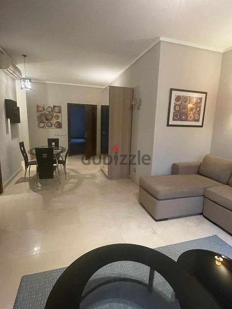 Chance furnished modern studio rent in The Village Palm Hills New Cairo 1
