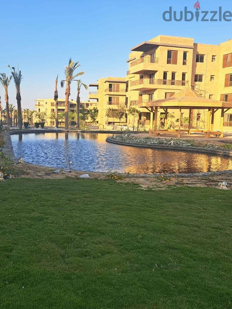 In front of Cairo Airport and Mirage City, a distinctive apartment with a clear sea corner, 166 square meters, for sale in Taj City Compound, New Cair 2
