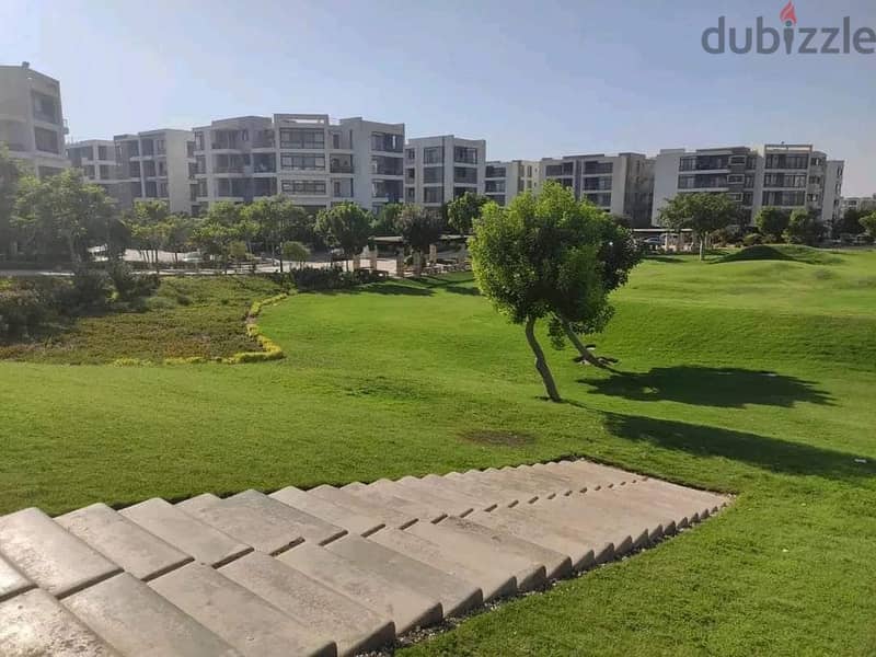 In front of Cairo Airport and Mirage City, a distinctive apartment with a clear sea corner, 166 square meters, for sale in Taj City Compound, New Cair 5