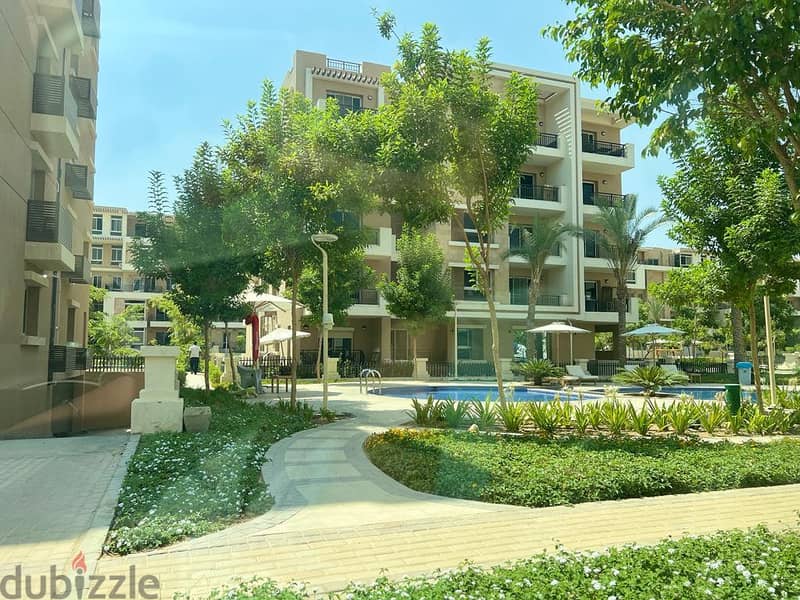 In front of Cairo Airport and Mirage City, a distinctive apartment with a clear sea corner, 166 square meters, for sale in Taj City Compound, New Cair 6