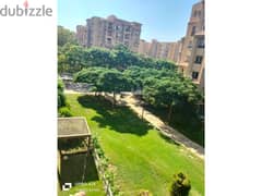 Apartment for sale in Madinaty, 135 square meters, with a garden view, located in B1, next to Metro Market.