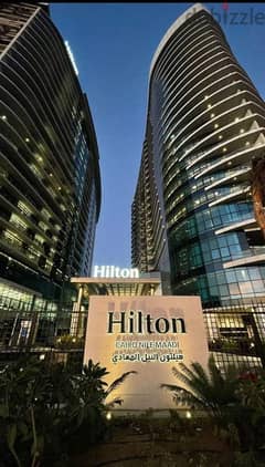 A hotel apartment with a panoramic view on the Nile, READY TO MOVE NOW!!, with Hilton services, ultra super luxury finishing, Nile Pearl Towers