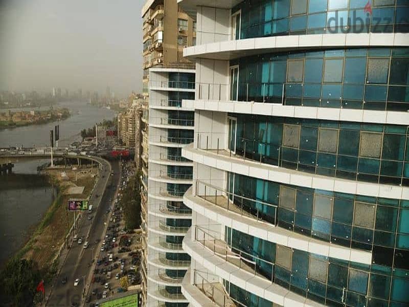 A hotel apartment with a panoramic view on the Nile, READY TO MOVE NOW!!, with Hilton services, ultra super luxury finishing, Nile Pearl Towers 8