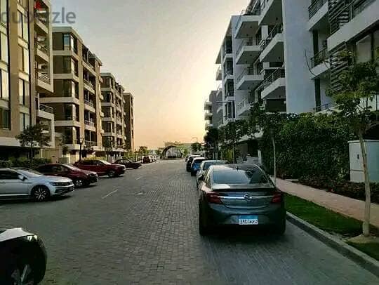 Duplex 158 meters with garden for sale in Taj City Compound, New Cairo, in front of Cairo Airport, at a special price and installments up to 8 years w 3