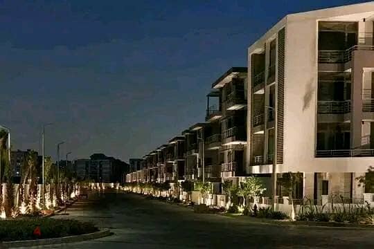 Duplex 158 meters with garden for sale in Taj City Compound, New Cairo, in front of Cairo Airport, at a special price and installments up to 8 years w 9