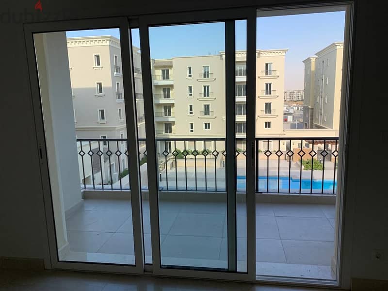 semi furnished Apartment 2rooms for rent in Mivida Boulevard  view pool 1
