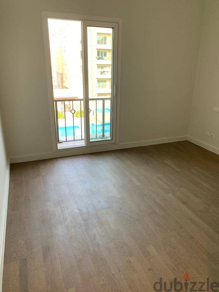 semi furnished Apartment 2rooms for rent in Mivida Boulevard  view pool 2