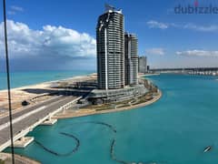For sale, a finished hotel apartment with air conditioners overlooking the sea, in installments, in El Alamein Towers